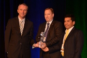 Paul Duffy (left), chairman of the Polyurethanes Technical Conference, presents the Polyurethane Innovation Award to Alan Robinson (centre), Dow