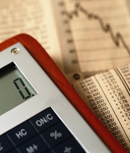 Photographer PhotoAlto/REX Shutterstock VARIOUS Calculator on top of financial charts 2000 