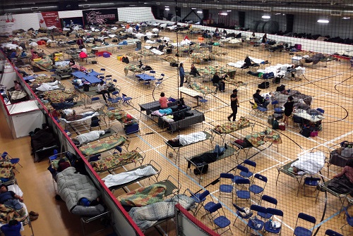 Cots litter the gym floor on 4 May 2016 at an evacuee centre set up by the regional municipality of Wood Buffalo in Anzac, Alberta. (Canadian Press/REX/Shutterstock)