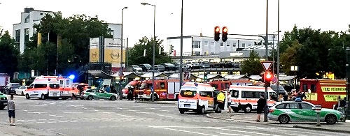 Photographer Xinhua News Agency/REX/Shutterstock Shooting in Olympia shopping centre, Munich, Germany - 22 Jul 2016 Photo taken by a mobile device shows police standing guard near the site of the shootout in Munich, Germany, on July 22, 2016. At least six people were killed in a shootout in the German city of Munich on Friday evening, German local media Focus Online reported. 22 Jul 2016 