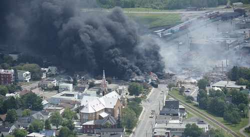 Freight train explosion, Lac-Megantic, Quebec, Canada - Jul 2013 Smoke rises from railway cars that were carrying crude oil after derailing in downtown Lac Megantic 6 Jul 2013 (Canadian Press/REX/Shutterstock) 
