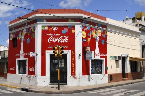 A corner house sports bright red advertising in Ciudad de Salta, Argentina, in 2008. (Thomas Vinke / imageBROKER/REX/Shutterstock)
