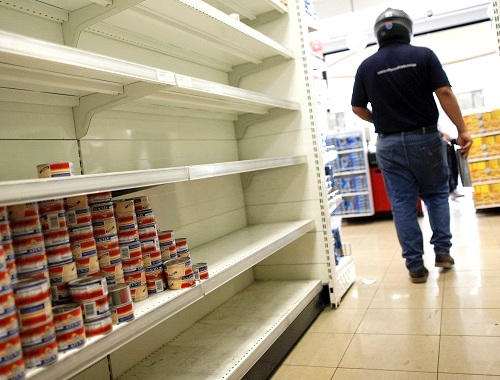 Empty supermarket shelves in Caracas illustrate the critical conditions in Venezuela. (Agencia EFE/REX/Shutterstock) 