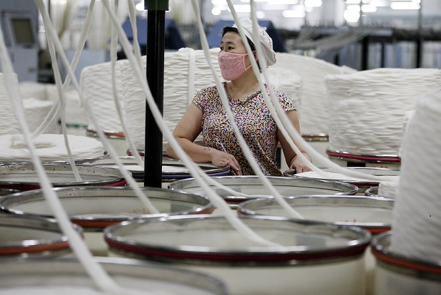 worker at China textile factory 1 August